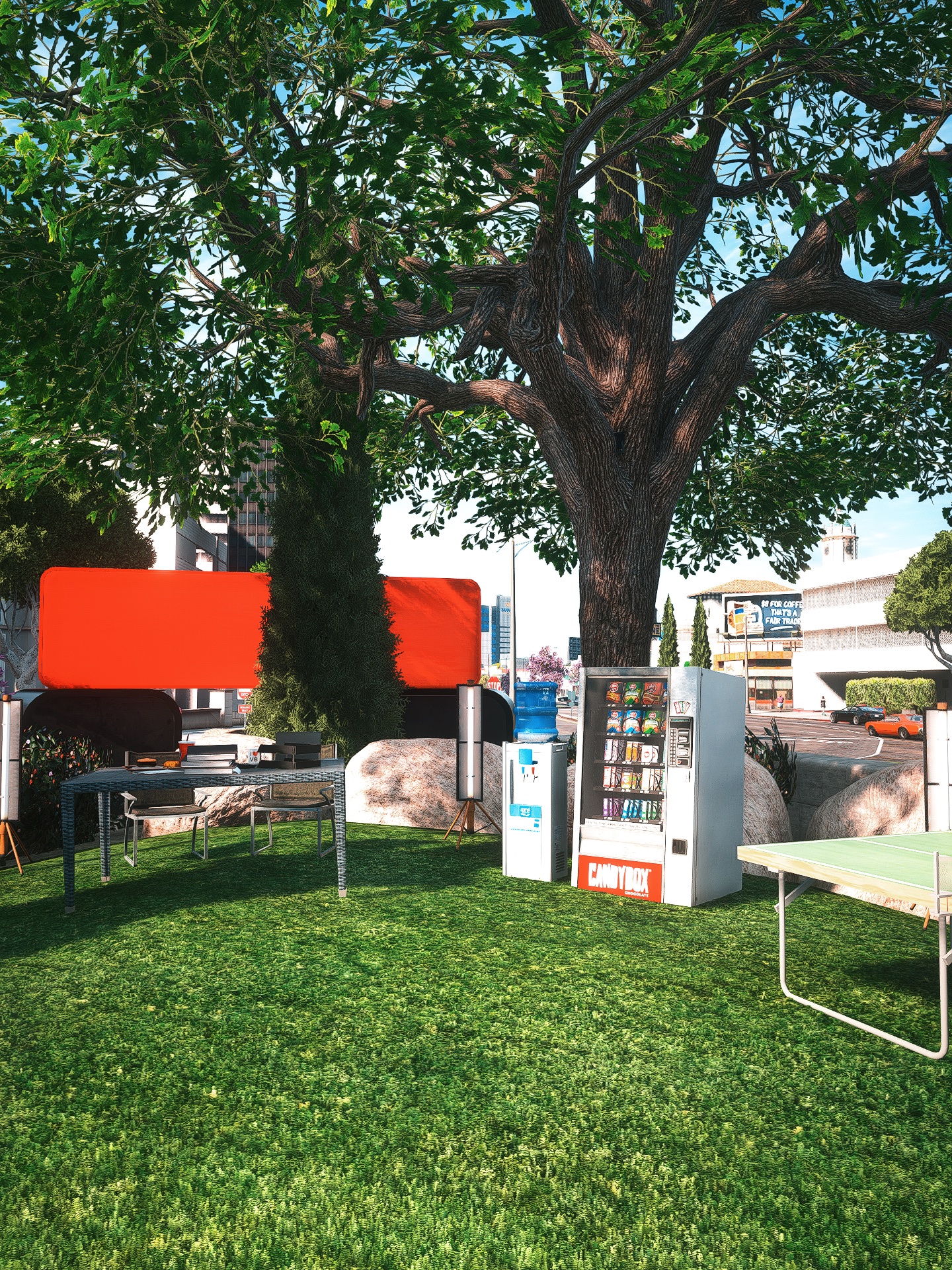 Employee Park at Lifeinvader headquarters with shaded desks, vending machines, a water cooler, and table tennis