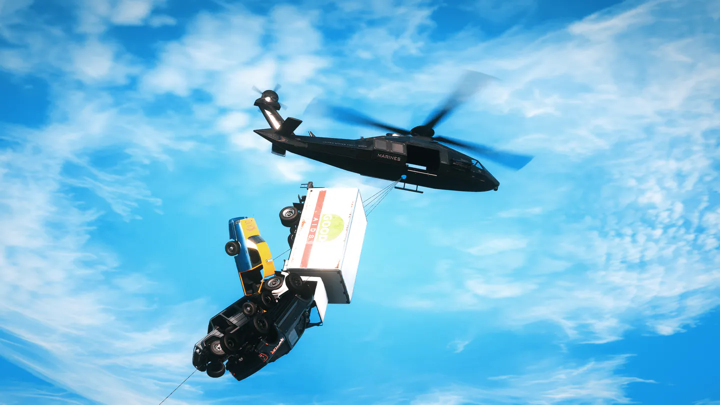 A helicopter lifting several vehicles through connected tethers
